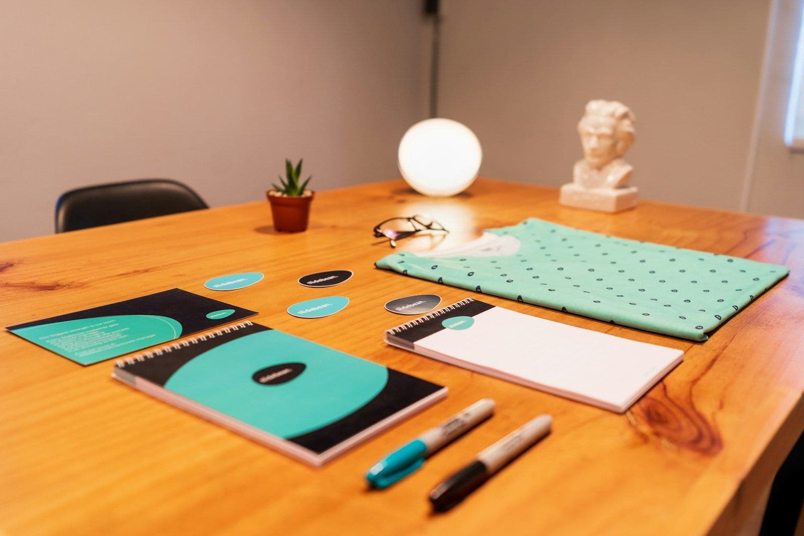 Brand stationery laid out on a wooden table