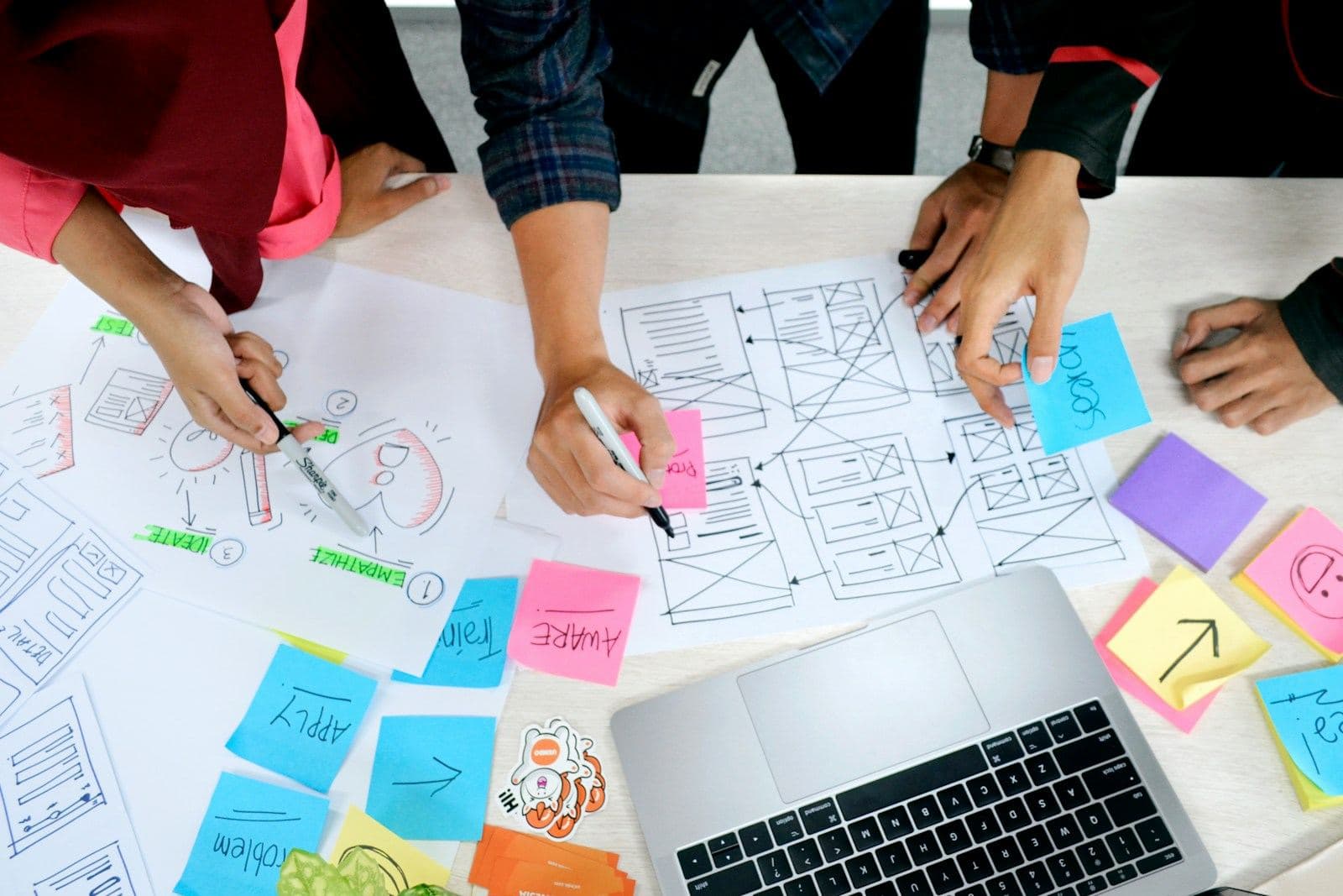 Designers sketching wireframes together