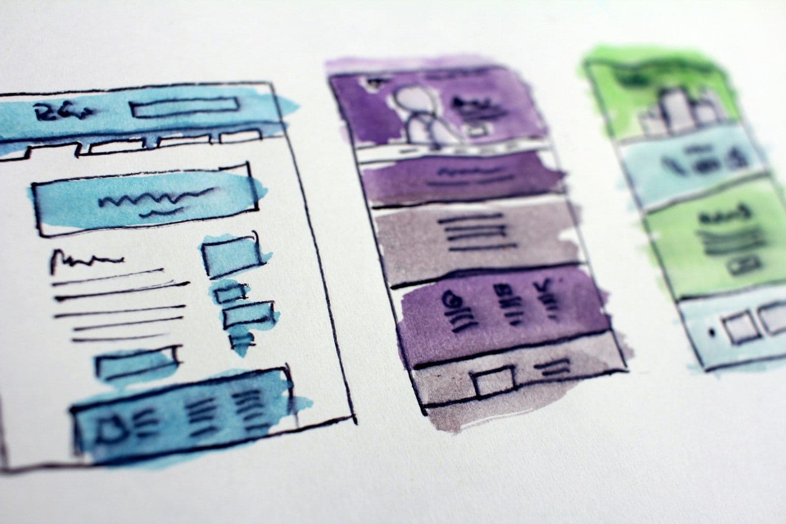 Watercolour wireframes of website layouts